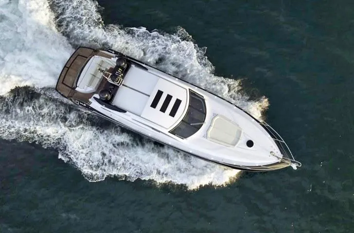  Yacht Photos Pics Aerial view of 2008 Sunseeker Predator 62 yacht cruising on water.