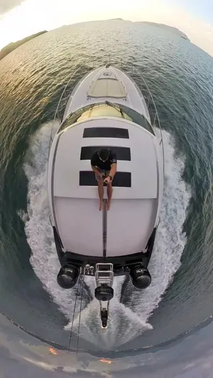  Yacht Photos Pics Aerial view of 2008 Sunseeker Predator 62 yacht cruising on open water.