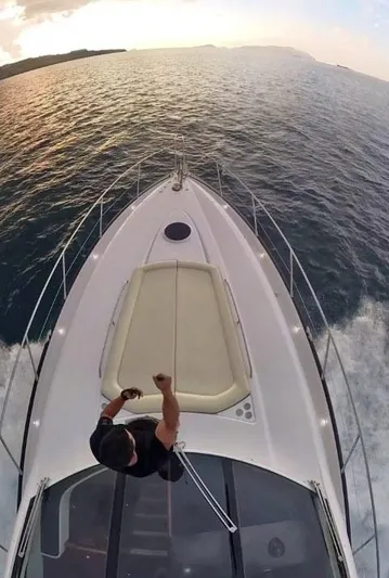  Yacht Photos Pics 2008 Sunseeker Predator 62 yacht cruising at sunset, aerial view.