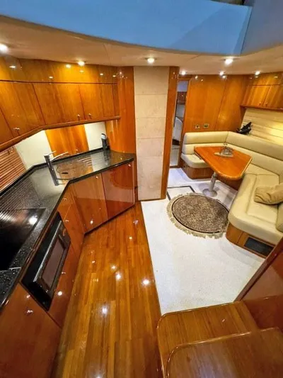  Yacht Photos Pics Luxurious interior of 2008 Sunseeker Predator 62 yacht with polished wood and modern amenities.