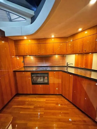  Yacht Photos Pics Luxurious wooden kitchen interior of 2008 Sunseeker Predator 62 yacht.