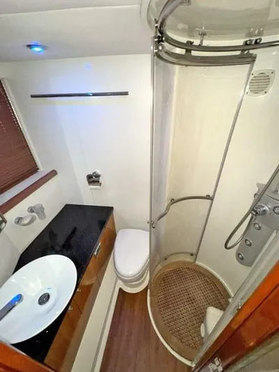  Yacht Photos Pics Luxurious bathroom in 2008 Sunseeker Predator 62 yacht with modern fixtures and shower.