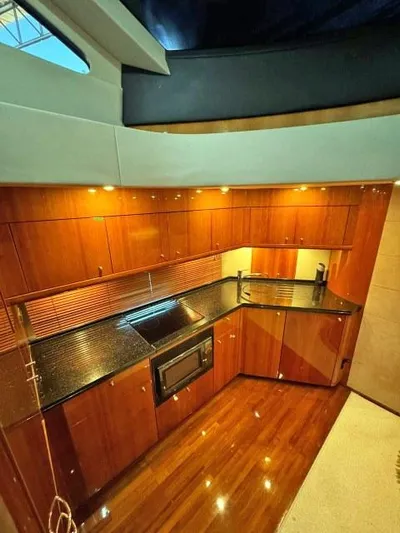  Yacht Photos Pics Luxurious kitchen interior of 2008 Sunseeker Predator 62 yacht with sleek wood cabinetry.
