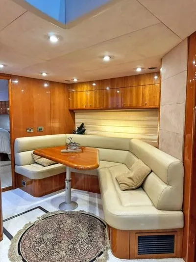  Yacht Photos Pics Luxurious interior of 2008 Sunseeker Predator 62 yacht with elegant seating and wooden finishes.