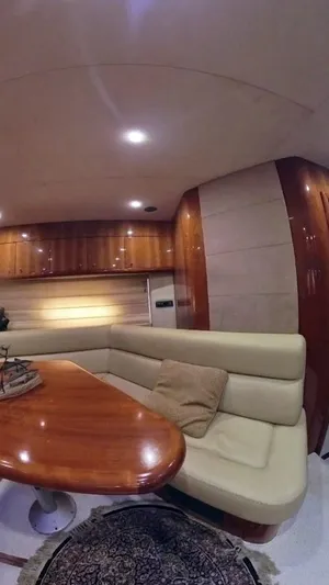  Yacht Photos Pics Luxurious interior of 2008 Sunseeker Predator 62 yacht with elegant seating and wooden finishes.