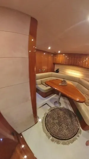  Yacht Photos Pics Luxurious interior of 2008 Sunseeker Predator 62 yacht with elegant wood finishes.