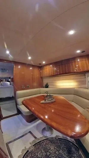  Yacht Photos Pics Luxurious interior of 2008 Sunseeker Predator 62 yacht with elegant wood finishes.
