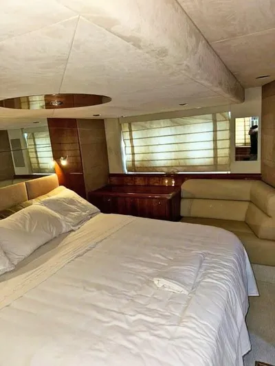  Yacht Photos Pics Luxurious bedroom interior of 2008 Sunseeker Predator 62 yacht with elegant furnishings.