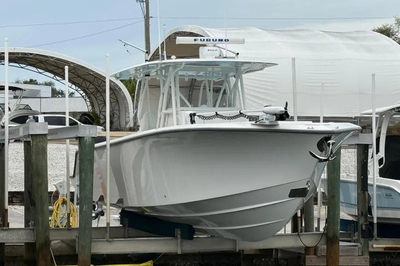  Yacht Photos Pics 2022 SeaVee 270Z boat docked, featuring sleek design and advanced equipment.