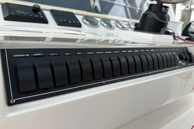  Yacht Photos Pics Control panel of a 2022 SeaVee 270Z boat with labeled switches.