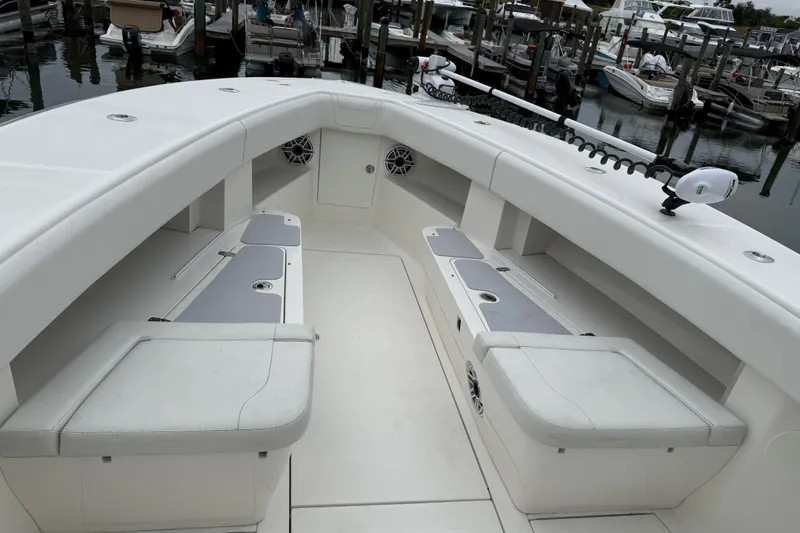  Yacht Photos Pics 2022 SeaVee 270Z boat interior with seating and storage, docked at marina.