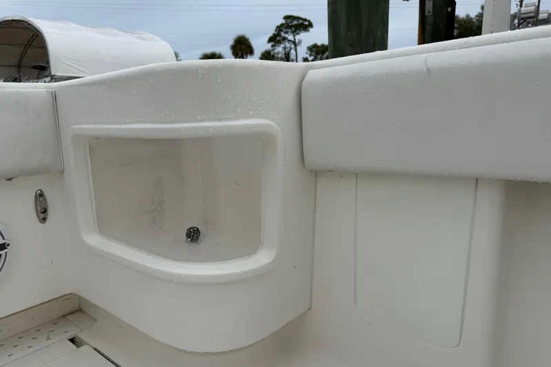  Yacht Photos Pics 2022 SeaVee 270Z boat interior detail with wet surfaces and storage compartment.
