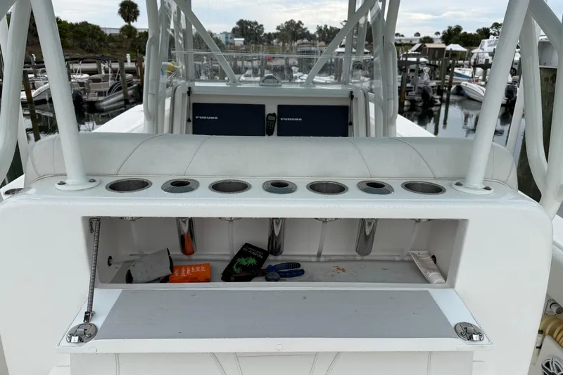  Yacht Photos Pics 2022 SeaVee 270Z boat with rod holders and storage compartment, docked at marina.