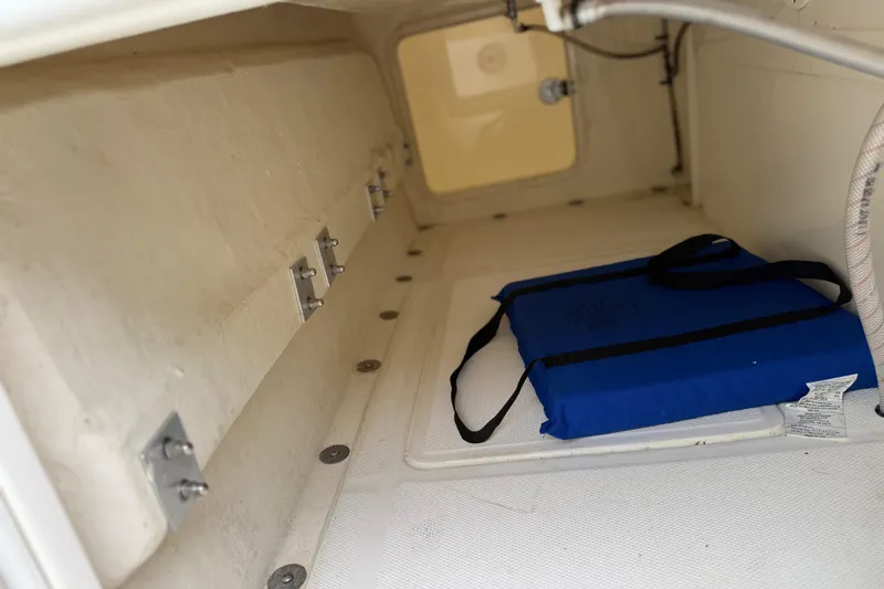  Yacht Photos Pics Interior storage compartment of 2022 SeaVee 270Z boat with blue cushion.