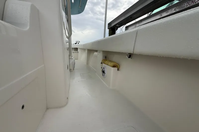  Yacht Photos Pics 2022 SeaVee 270Z boat interior with clean white deck and speaker detail.