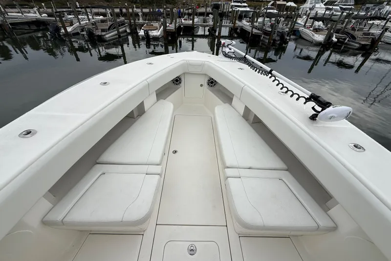  Yacht Photos Pics 2022 SeaVee 270Z boat interior with white seating, docked at marina.