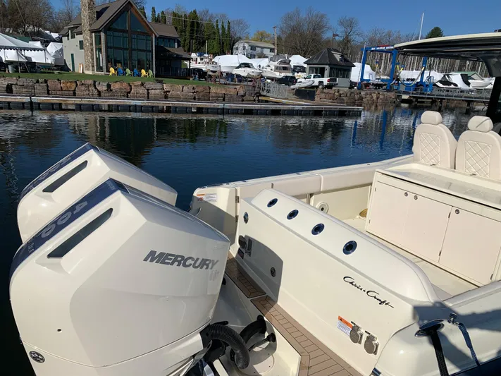  Yacht Photos Pics 2024 Chris-Craft Catalina 34 with Mercury engines docked at a marina.
