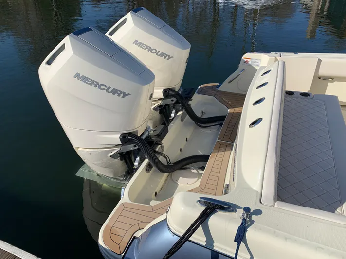  Yacht Photos Pics 2024 Chris-Craft Catalina 34 with dual Mercury outboard engines, docked on calm water.