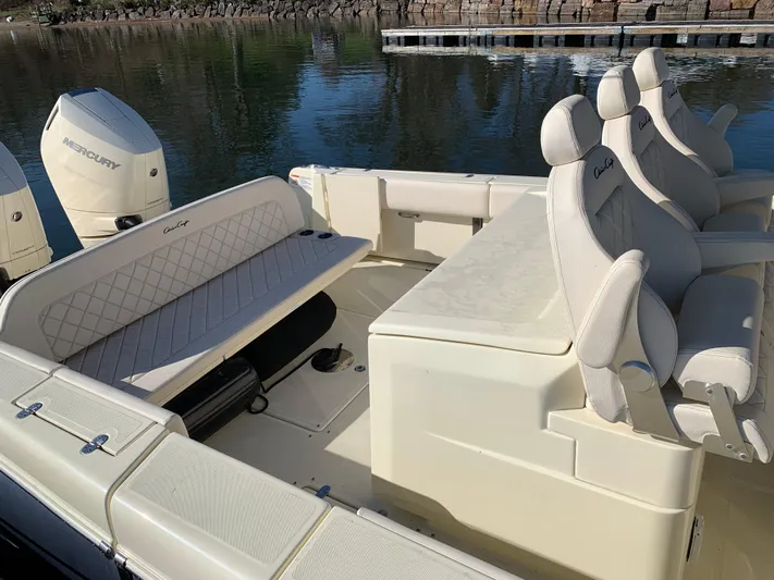  Yacht Photos Pics 2024 Chris-Craft Catalina 34 boat interior with seating and Mercury engines.