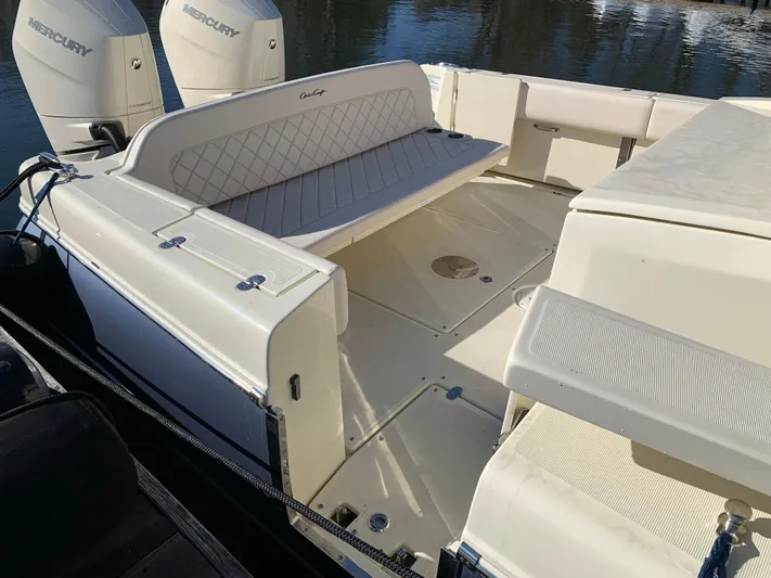  Yacht Photos Pics 2024 Chris-Craft Catalina 34 boat interior with seating and Mercury engines.