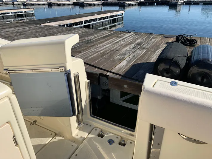  Yacht Photos Pics 2024 Chris-Craft Catalina 34 boat docked, showing open side gate and marina view.