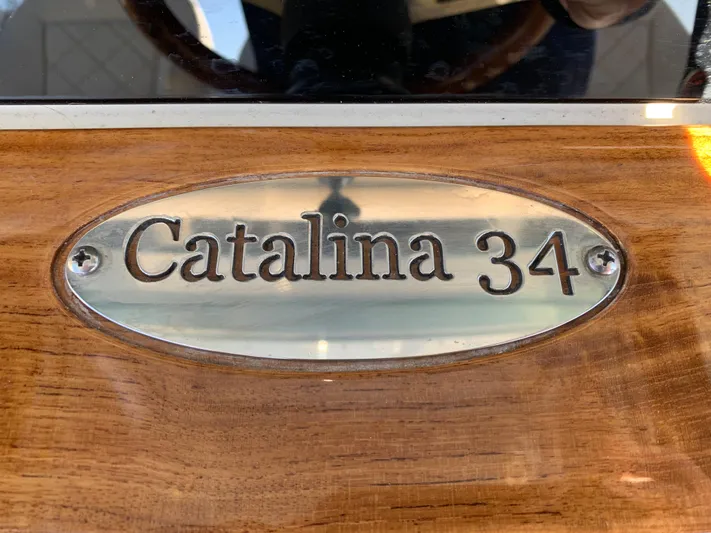  Yacht Photos Pics 2024 Chris-Craft Catalina 34 nameplate on polished wood surface.