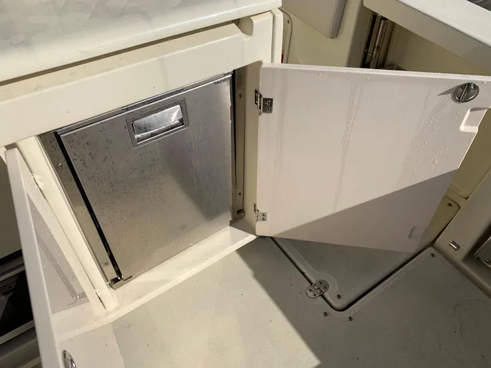  Yacht Photos Pics 2024 Chris-Craft Catalina 34 interior storage compartment with open door.