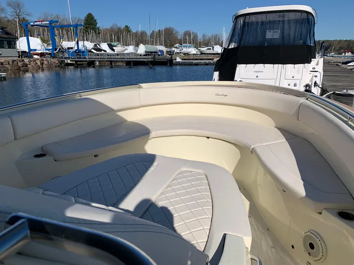  Yacht Photos Pics 2024 Chris-Craft Catalina 34 boat with spacious seating, docked at a marina.