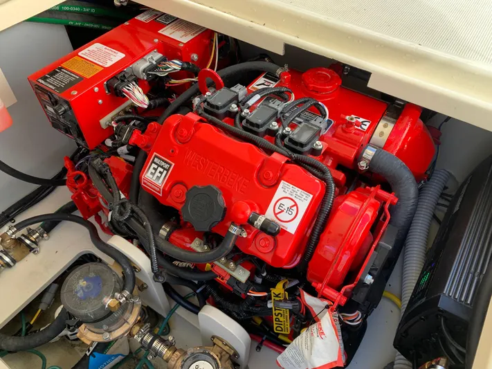  Yacht Photos Pics Engine compartment of 2024 Chris-Craft Catalina 34, featuring a vibrant red engine.