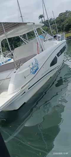 Mv Splash Yacht Photos Pics 2017 Jeanneau Cap Camarat 10.5 boat docked in a marina, side view.