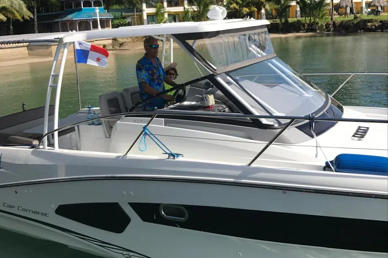 Mv Splash Yacht Photos Pics 2017 Jeanneau Cap Camarat 10.5 boat on water, Panama flag, tropical background.
