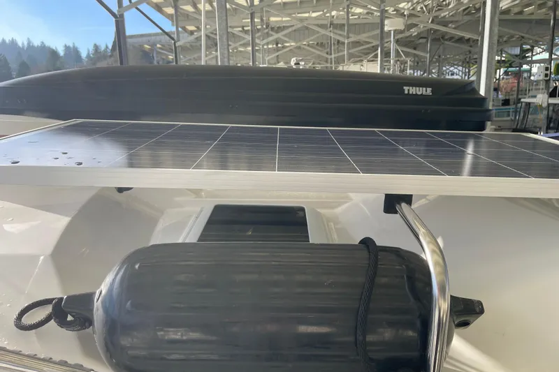  Yacht Photos Pics 2019 Ranger Tugs R-27 with solar panel and fender under covered dock.