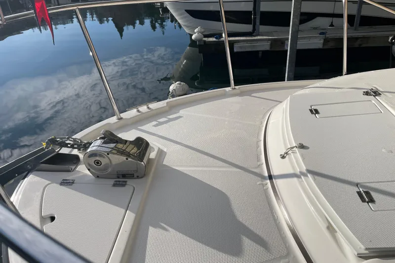  Yacht Photos Pics 2019 Ranger Tugs R-27 boat deck with anchor system, docked by calm water.