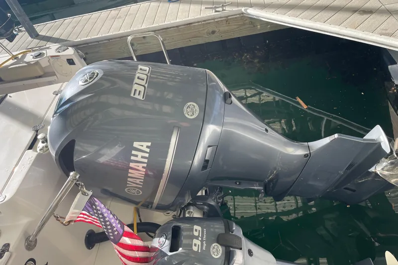  Yacht Photos Pics 2019 Ranger Tugs R-27 with Yamaha 300 outboard motor, docked with American flag.