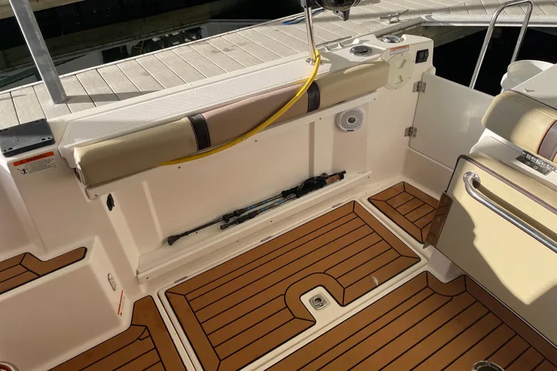  Yacht Photos Pics 2019 Ranger Tugs R-27 boat interior with teak flooring and storage compartment.