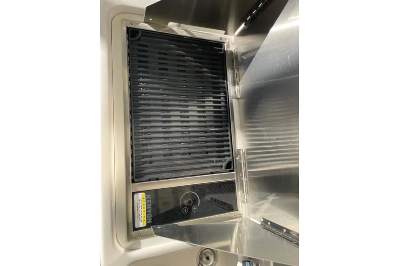  Yacht Photos Pics Built-in grill on 2019 Ranger Tugs R-27 boat, featuring sleek stainless steel design.
