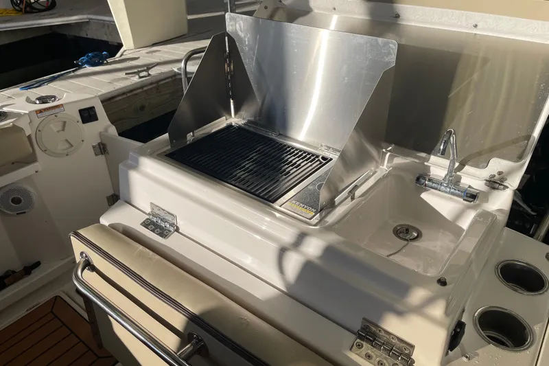  Yacht Photos Pics Outdoor kitchen on 2019 Ranger Tugs R-27 boat with grill and sink.