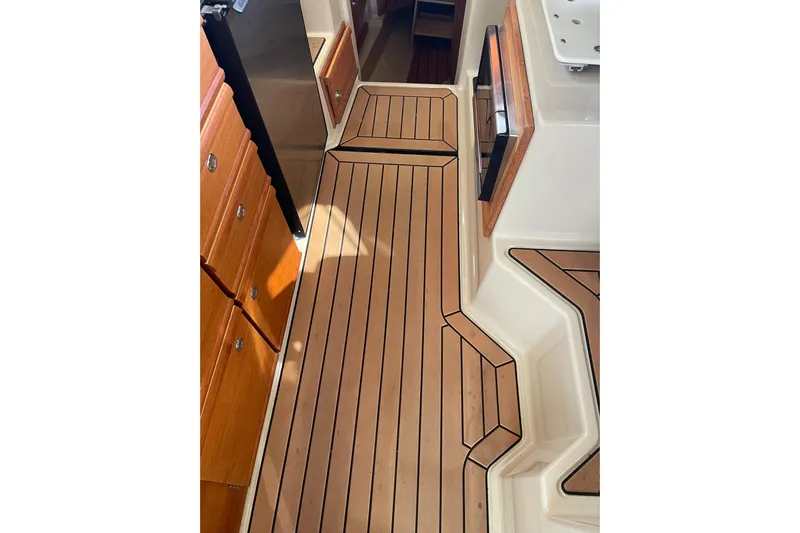  Yacht Photos Pics 2019 Ranger Tugs R-27 interior with wood flooring and cabinetry.