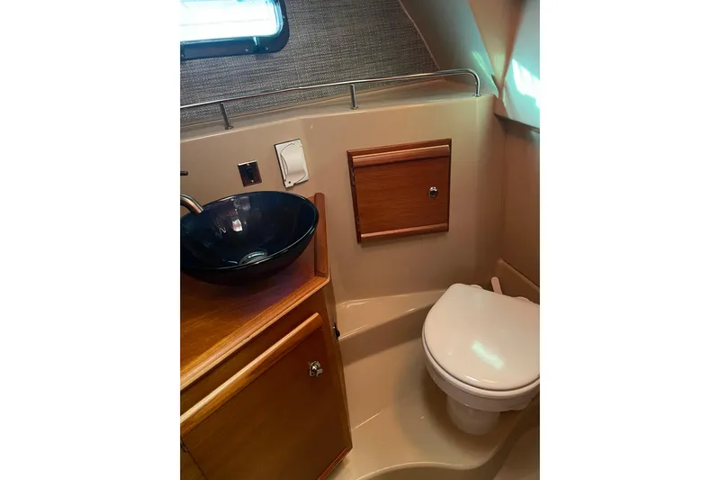  Yacht Photos Pics 2019 Ranger Tugs R-27 boat bathroom with modern sink and toilet.