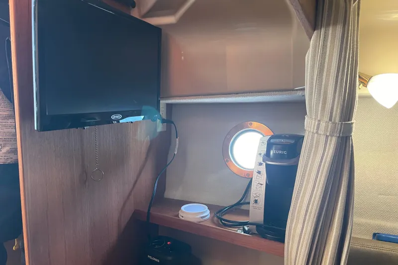  Yacht Photos Pics Interior of 2019 Ranger Tugs R-27 with TV, Keurig coffee maker, and porthole.