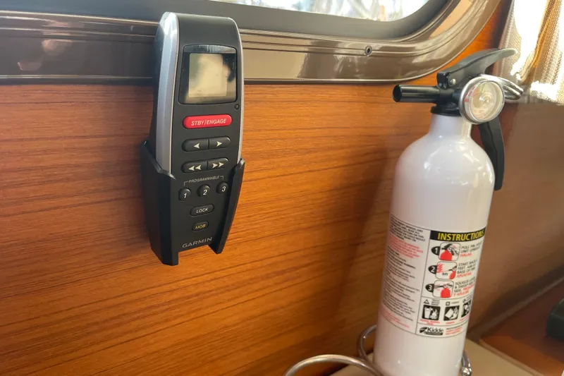  Yacht Photos Pics Garmin remote and fire extinguisher on 2019 Ranger Tugs R-27 boat interior.