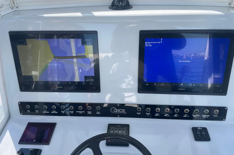  Yacht Photos Pics Control panel of a 2022 Conch 33 boat with dual Garmin displays.