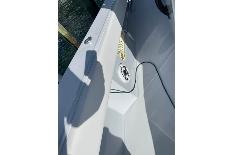  Yacht Photos Pics 2022 Conch 33 boat interior with speaker and coiled rope.