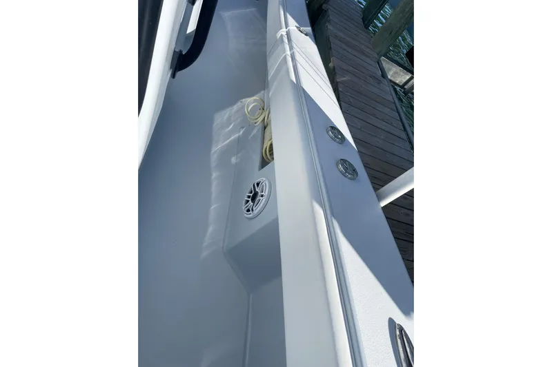  Yacht Photos Pics 2022 Conch 33 boat deck with speaker and rope, dockside view.