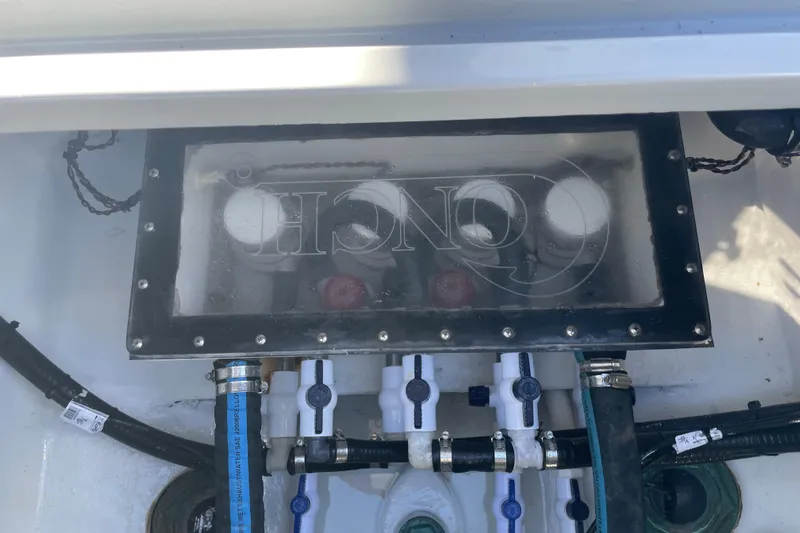  Yacht Photos Pics Engine compartment of 2022 Conch 33 boat with visible hoses and fittings.