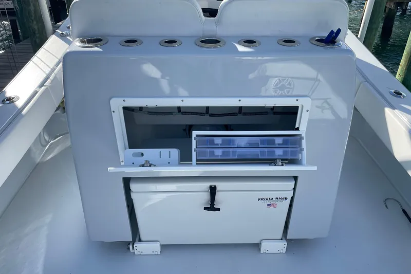  Yacht Photos Pics 2022 Conch 33 boat with storage compartments and rod holders on deck.