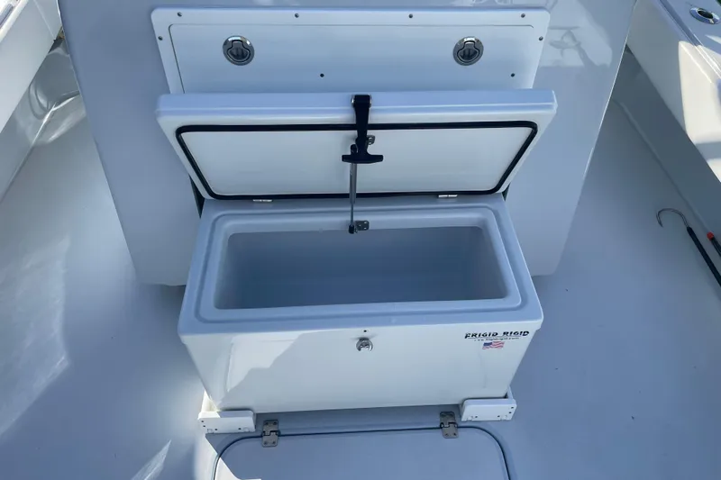  Yacht Photos Pics Open storage compartment on 2022 Conch 33 boat, featuring Frigid Rigid cooler.