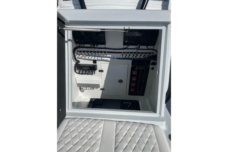  Yacht Photos Pics Electrical panel inside 2022 Conch 33 boat, featuring organized wiring and controls.