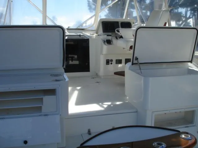 Bait's Factor Yacht Photos Pics 2002 Stolper 35 EXPRESS boat interior with helm, seating, and storage compartments.