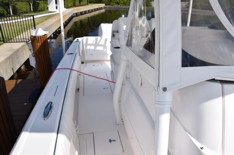  Yacht Photos Pics 2017 Intrepid 327 boat docked, featuring spacious white deck and seating area.